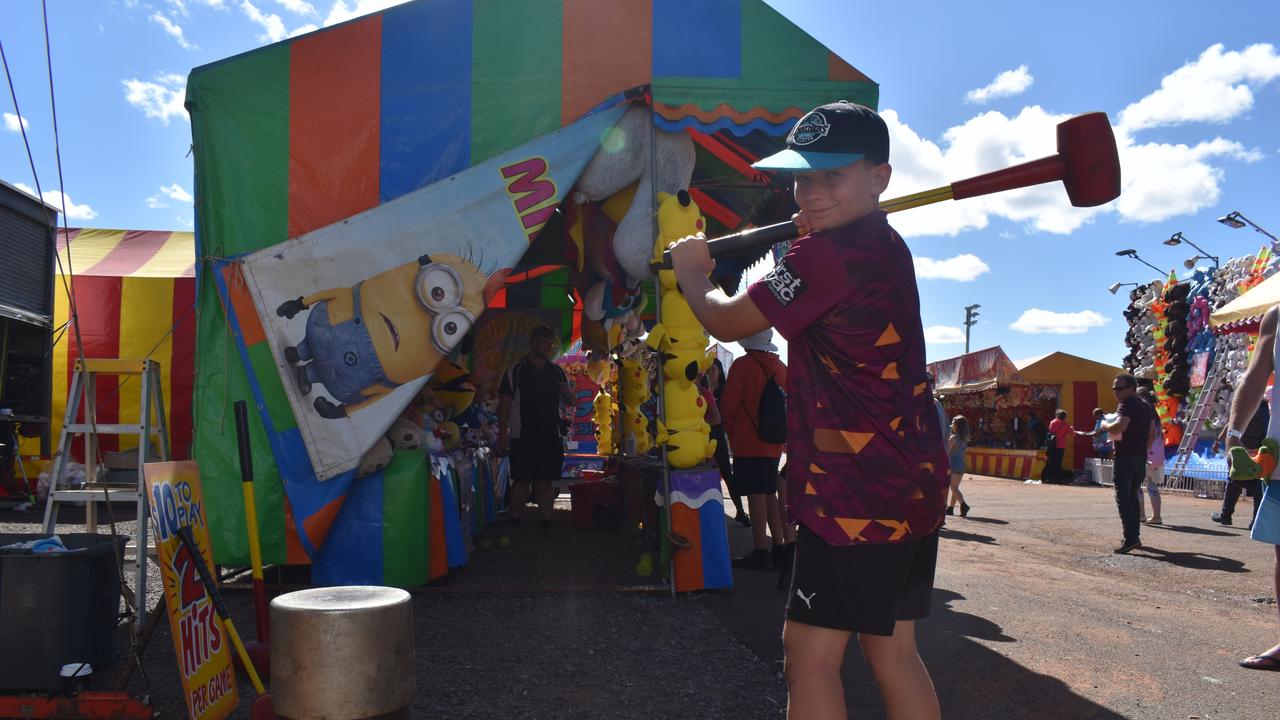 Stuart Westblade from Dundowran Beach prepares to have a go on the High Striker game at the Fraser Coast. Photo: Stuart Fast