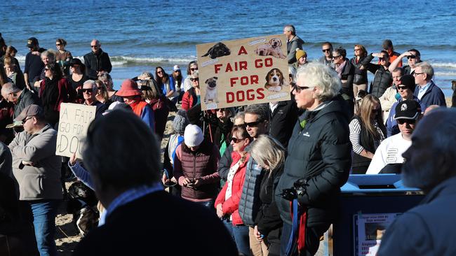 Concerned dog owners at the rally at Kingston Beach about Kingborough Council's proposed new policy. Picture: LUKE BOWDEN