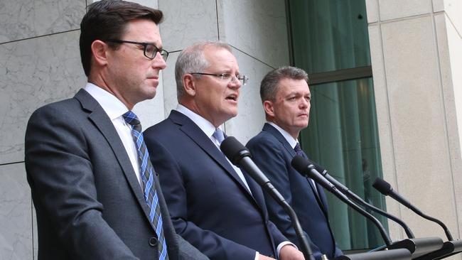 Emergency Management Minister David Littleproud, PM Scott Morrison and National Bushfire Recovery Agency Coordinator Andrew Colvin in Canberra today. Picture: AP