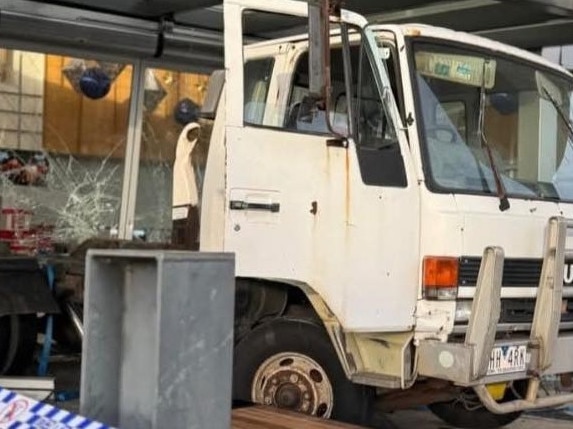 The skip bin loader truck became stuck over theft prevention bollards at the front of the centre on Monday morning. Picture: Facebook