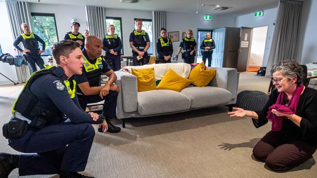 Constable Tash Turner and Sergeant Sooraj Pokiri engage with environmental mental health clinician Sally Kershaw as she role plays a highly agitated person during the simulation. Picture: Jake Nowakowski