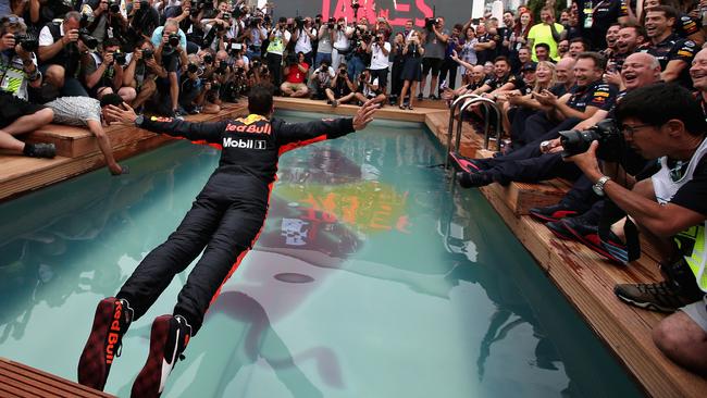 McLaren F1 star Daniel Ricciardo performs a swan dive into the pool after winning the 2018 Monaco Grand Prix with Red Bull. Picture: Charles Coates/Getty Images