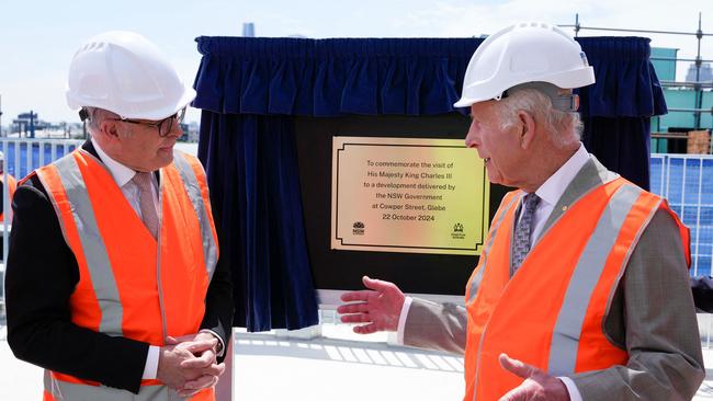 Britainâ€™s King Charles III (R) talks with Australia’s Prime Minister Anthony Albanese during his visit at the Homes NSW Cowper Street development in Sydney on October 22, 2024. Picture: Mark Baker / POOL / AFP