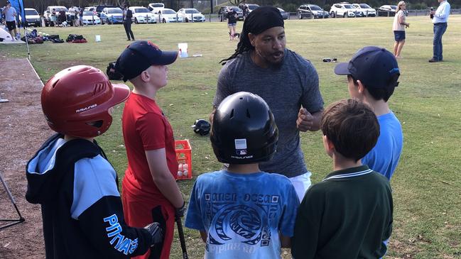 Manny Ramirez gives the junior players the benefit of his experience. Picture: Jim O'Rourke