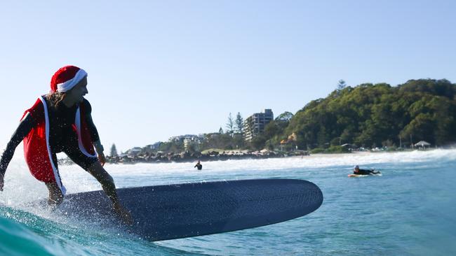 Swapping the sleigh for a surfboard was a great idea for Santa and his helpers. Photo: Luke Workman/@photo_13_ /Instagram