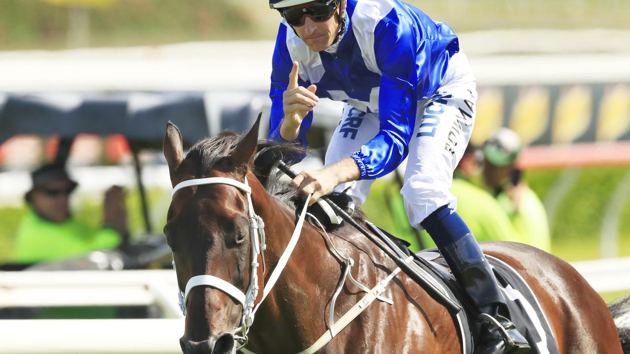 Hugh Bowman gestures after winning the Apollo Stakes on Winx.