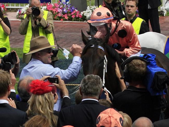 Moody congratulates Nolen after Black Caviar made it 18 consecutive wins in the Group 1 Orr Stakes, her first test beyond 1200m.