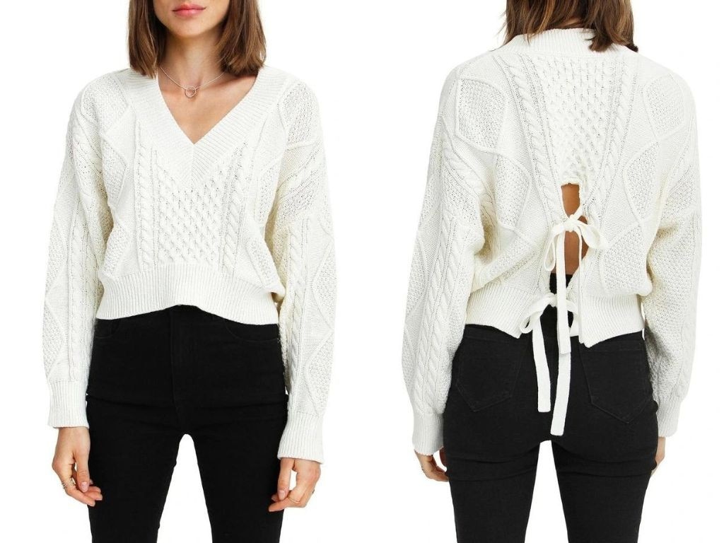 We love the unique back design of this cable knit sweater.