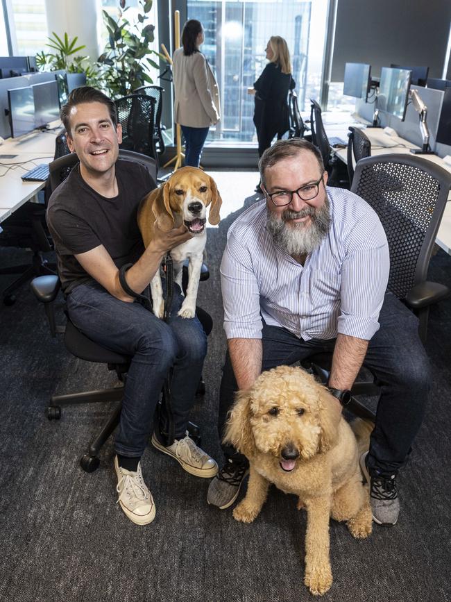 Amazon Australia employees, known as Amazonians, Jack Mason with his dog or ‘pupazonian’ Herbie and Dennis Dugandzic with his dog Leo.