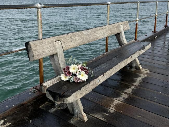 Flowers left at the pier following the random killing of fisherman Andres Pancha.