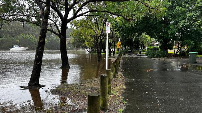 Flood waters are spilling over the road near East Hills in Sydney's southwest on March 2 2022. Picture: NSW SES Bankstown