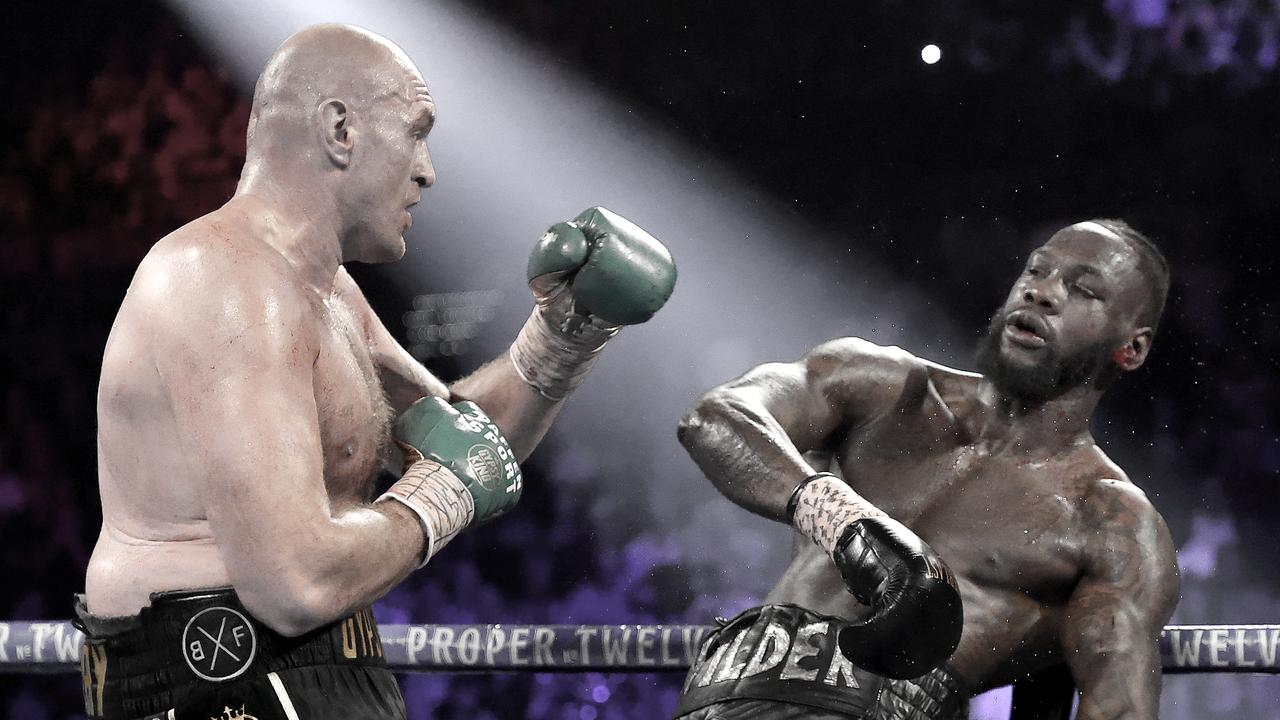 Tyson Fury knocks down Deontay Wilder in his massive win.