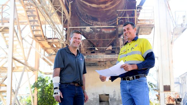 Brad Neven, Executive Manager, and Jason Thomasson, owner of the JRT Group, look over the demolition plans for th eold Yaamba Rd cement works to make way for a 50-hectare industrial estate