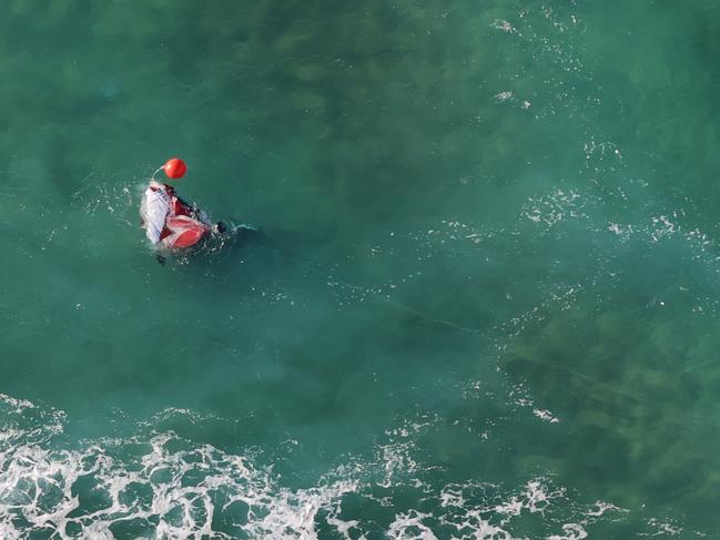 The wreckage of a microlight aircraft which crashed in the sea south of Nambucca Heads yesterday. Picture: Supplied