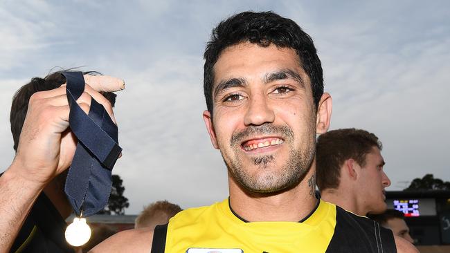 Marlion Pickett shows off his Norm Goss Medal after being best on ground in Richmond’s VFL premiership. Picture: Quinn Rooney/Getty Images.