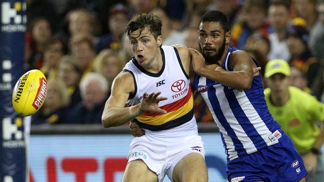 North Melbourne’s Tarryn Thomas competes with Adelaide defender Jake Kelly in Round 4. Picture: Hamish Blair/AAP