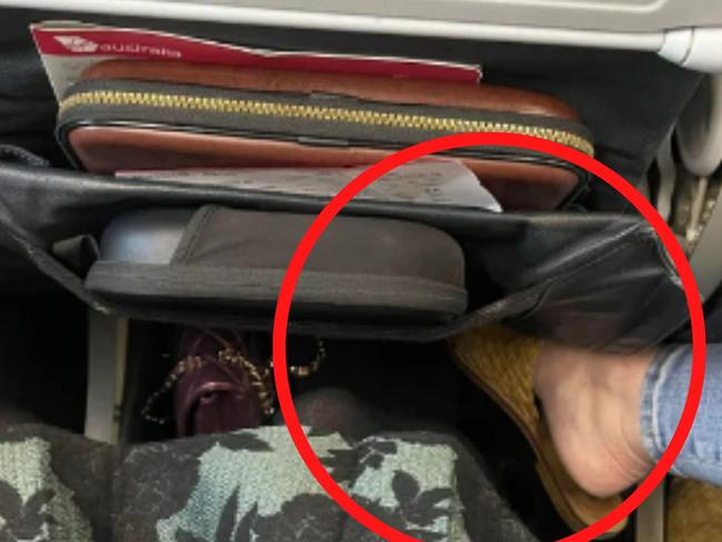 A passenger sitting on the aisle seat has sparked debate online, as many question whether she has broken plane etiquette. Picture: Reddit