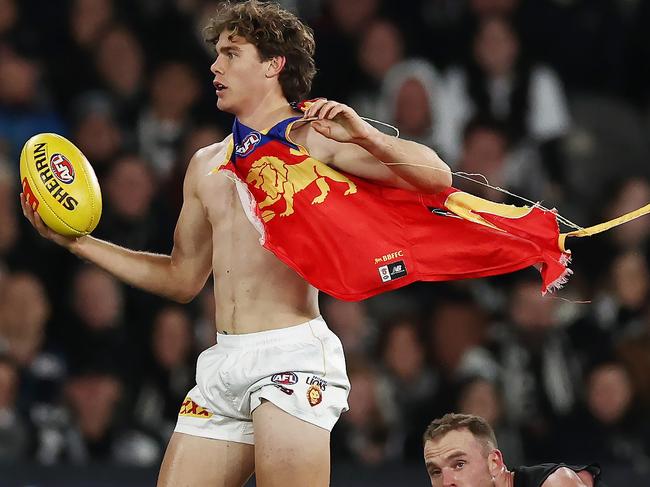 MELBOURNE, AUSTRALIA - August 18, 2023. AFL .   Deven Robertson of the Lions after having his jumper ripped during the round 23 match between Collingwood and the Brisbane Lions at Marvel Stadium in Melbourne, Australia.  Photo by Michael Klein.