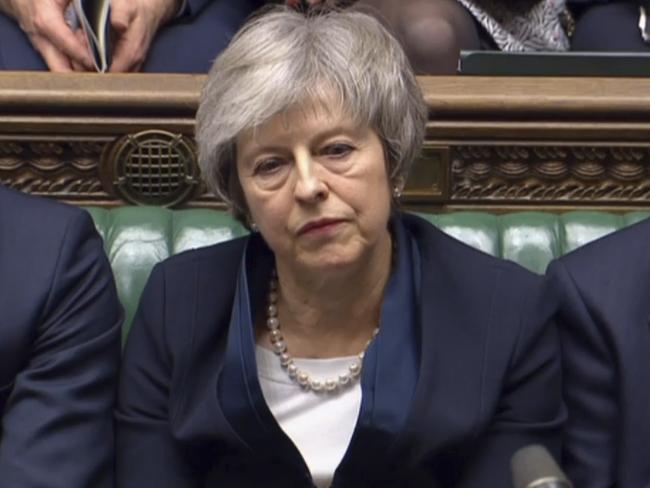 In this grab taken from video, Britain's Prime Minister Theresa May listens to Labour leader Jeremy Corbyn speaking after losing a vote on her Brexit deal, in the House of Commons, London, Tuesday Jan. 15, 2019.  British lawmakers have plunged Brexit into chaos and the U.K. politics into crisis by rejecting Prime Minister Theresa May's divorce deal with the European Union. The 432 to 202 vote in the House of Commons was widely expected but still devastating for May, whose fragile leadership is now under siege. (House of Commons/PA via AP)