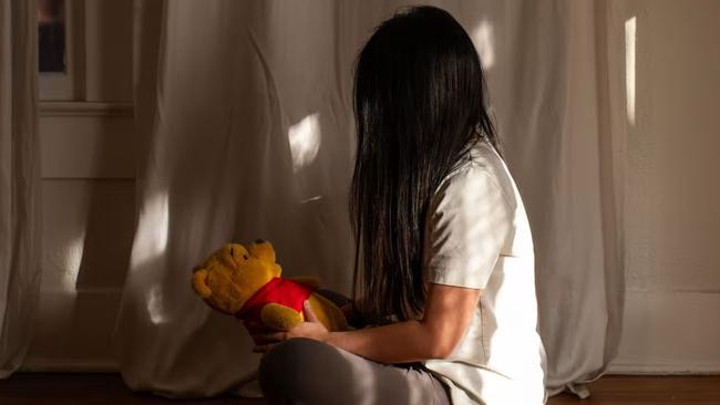 Alex Zhu and a stuffed Winnie the Pooh. The character is sometimes said to resemble Chinese leader Xi Jinping. Picture: Kaylee Greenlee for WSJ