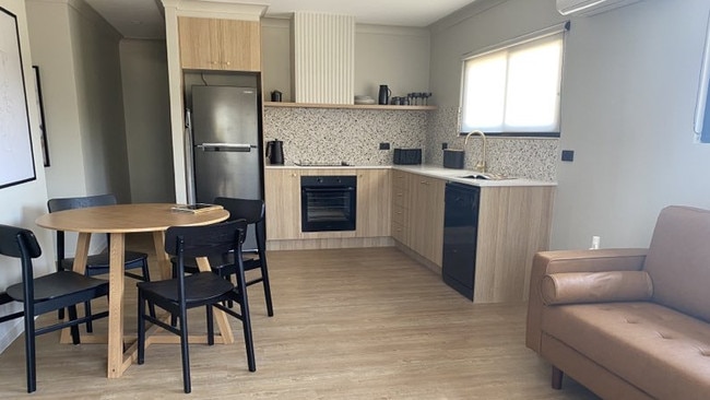 The living and kitchen area of the family room at Motel Caloundra.