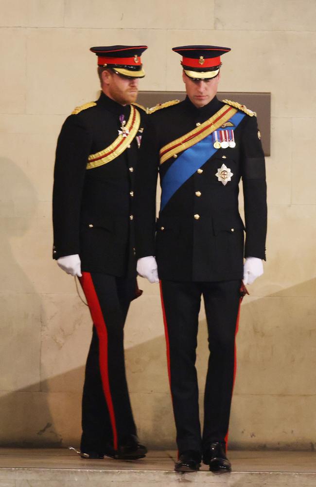 Prince William and Prince Harry, pictured at the Queen’s coffin vigil, reunited in an “awkward” truce to mourn their grandmother. Picture: Getty Images.