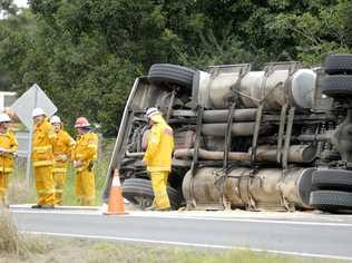 Rural firefighters on standby after a truck rolled  over on Bangalow Road near Binna Burra. Picture: Jay Cronan