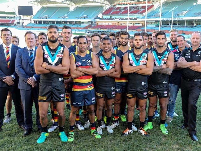 Crows and Power officials, indigenous players and leadership groups unite against racism at Adelaide Oval earlier this season. Picture: Russell Millard