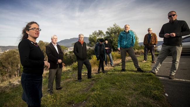 SUN TAS: Sophie Underwood, left, from Planning Matters Alliance Tasmania, and other stakeholders against the proposed major projects legislation convene on top of Rosny Hill. Picture: LUKE BOWDEN