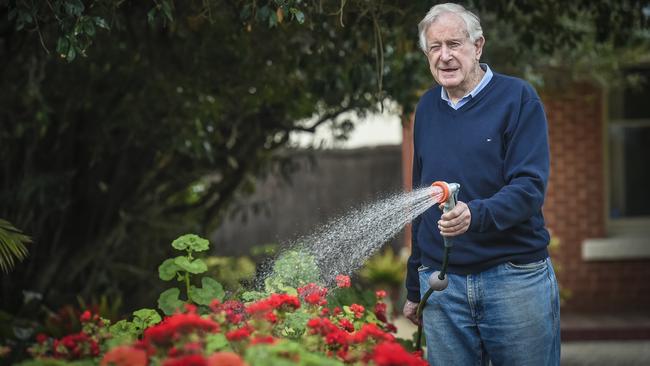 Jack Messenger waters his Glenelg garden from his bore, which, as of Thursday, will be prohibited. Picture: AAP / Roy VanDerVegt