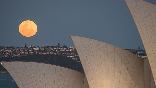 A smaller supermoon to Monday’s supermoon rises above the Sydney skyline in September 2015.