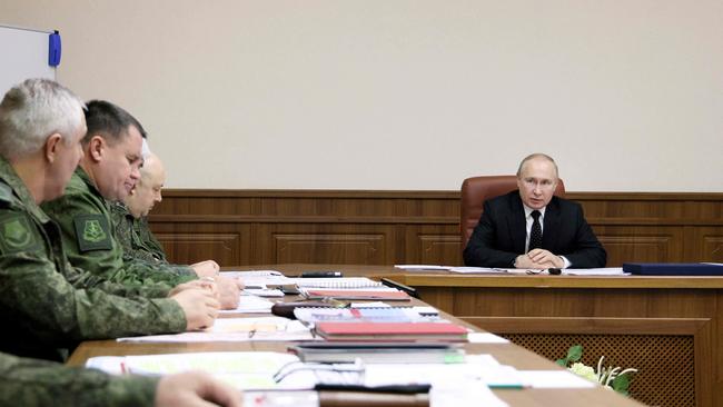 Vladimir Putin meets commanders involved in Russia's military operation in Ukraine in an undisclosed place in Russia on December 17. Picture: AFP