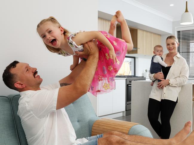 Demima and Jonathon Cucca with their kids. Eliana , 3, and Giorgio, 5 months, at their house they sold in Ripley. Picture: Liam Kidston