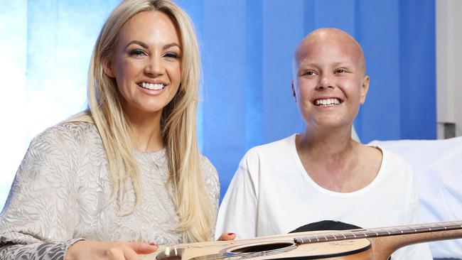 Samantha Jade with patient Zoie Moore (18) Sydney Children's Hospital, Randwick. Aussie pop star Samantha Jade, an ambassador for the Sony Foundation,  a guitar which has been signed by all the artists involved in the Sony charity single, that will be auctioned off.