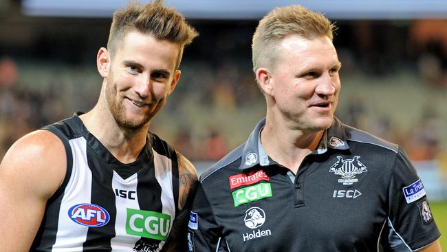 Nathan Buckley celebrates Collingwood’s win over Geelong with Jeremy Howe. Picture: AAP Images