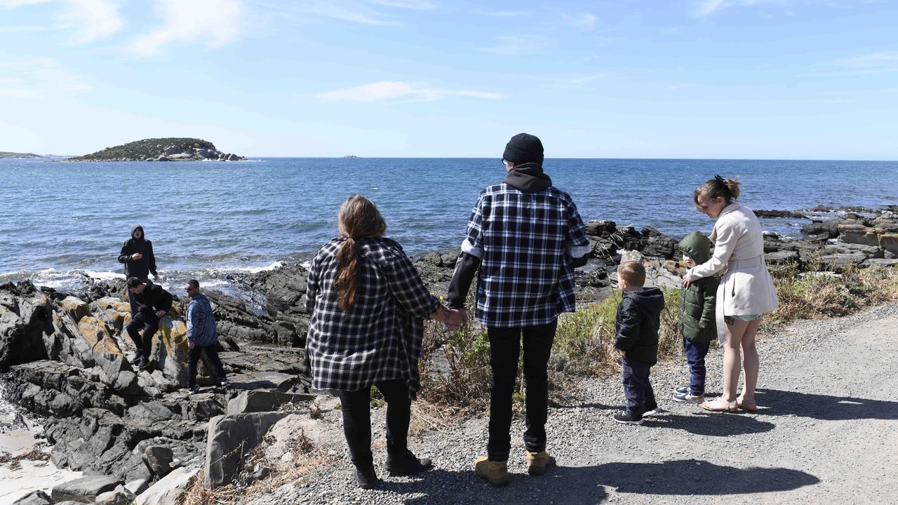 Derek Robinson is reunited with his family as he disembarks on to Granite Island. Picture: NCA NewsWire / Picture: Naomi Jellicoe