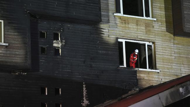 Firefighters and emergency teams work after a fire that broke out at a hotel in the ski resort of Kartalkaya. Picture: AP Photo/Francisco Seco