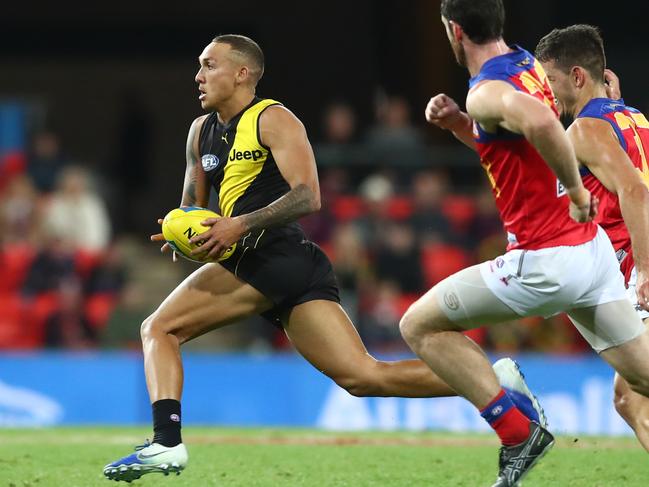 GOLD COAST, AUSTRALIA - AUGUST 04: Shai Bolton of the Tigers runs the ball during the round 10 AFL match between the Richmond Tigers and the Brisbane Lions at Metricon Stadium on August 04, 2020 in Gold Coast, Australia. (Photo by Chris Hyde/Getty Images)