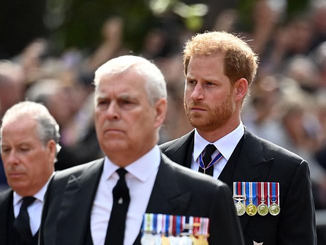 Britain's Prince Andrew, Duke of York and Britain's Prince Harry, Duke of Sussex walk behind the coffin of Queen Elizabeth II, during a procession from Buckingham Palace to the Palace of Westminster, in London on September 14, 2022. - Queen Elizabeth II will lie in state in Westminster Hall inside the Palace of Westminster, from Wednesday until a few hours before her funeral on Monday, with huge queues expected to file past her coffin to pay their respects. (Photo by Kate Green / POOL / AFP)