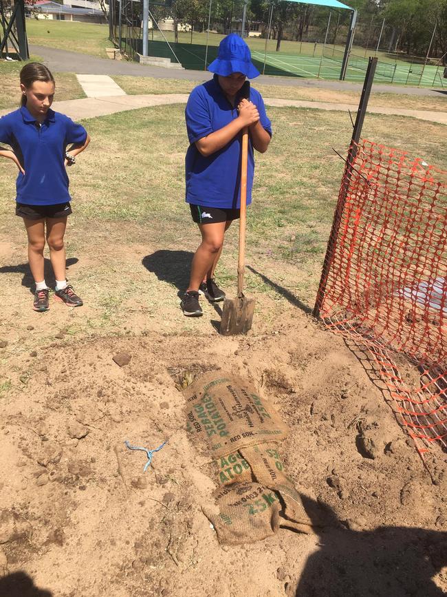 The ‘kup murri’ in the ground cooking up a delicious feast of tender meat and vegetables. Photo: Contributed