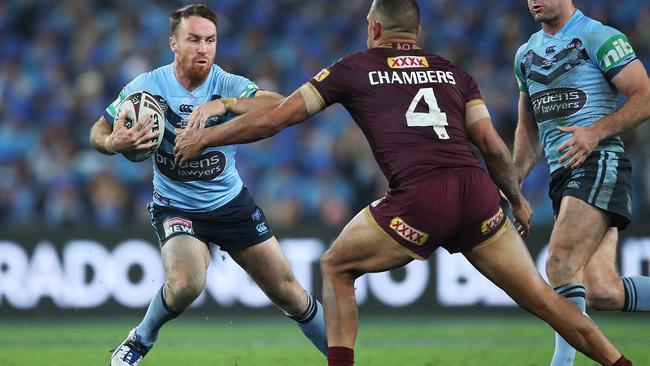 James Maloney (left) puts a move on Will Chambers during Origin II. Photo: Phil Hillyard