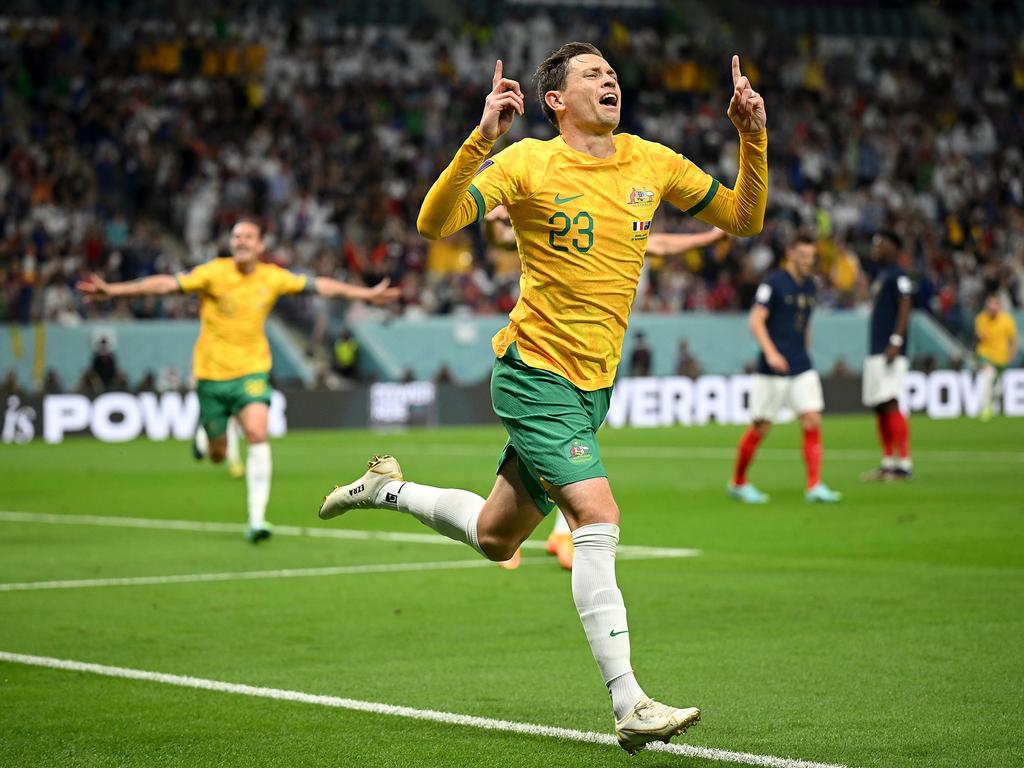 Craig Goodwin celebrates scoring the opener against France.