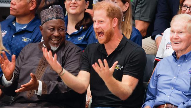 Britain's Prince Harry, Duke of Sussex (2R) reacts as he attends the Wheelchair Rugby Canada vs New Zealand match of the 2023 Invictus Games in Duesseldorf, western Germany on September 10, 2023. The Invictus Games, an international sports competition for wounded soldiers founded by British royal Prince Harry in 2014 run from September 9 to 16, 2023 in Duesseldorf. (Photo by Odd ANDERSEN / AFP)