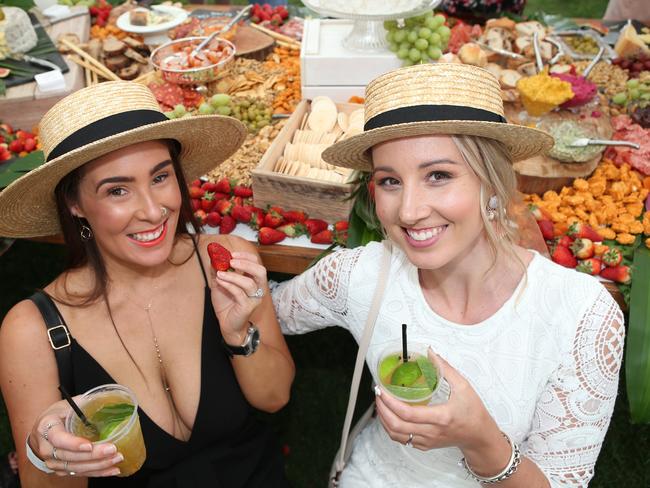 Renee McCaskirr and Hayley Wood enjoy a feast in the Cotton On marquee. Picture: Glenn Ferguson