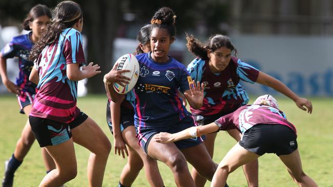 Titans Schools League at Burleigh Bears Junior Rugby League. Year 7/8 Division 1 girls:Keebra Park v Mabel Park . Mabel Parks Tiahna Kanawi tries to break through the Keebra defence.. Picture Glenn Hampson