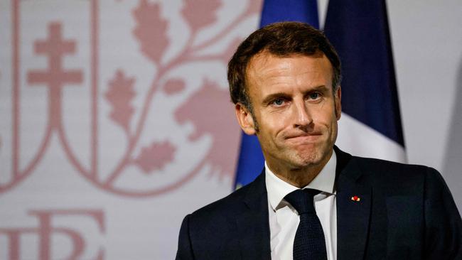 French President Emmanuel Macron looks on as delivers a speech during a meeting with French nationals living in Thailand at the Peninsula hotel in Bangkok on november 17, 2022, as he visits Thailand for the APEC Summit. (Photo by Ludovic MARIN / AFP)