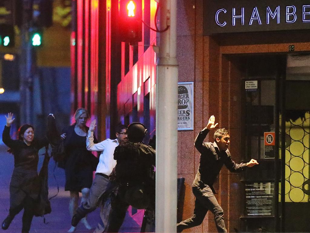 A group of hostage make their escape just before gunfire erupts. Picture: Getty Images