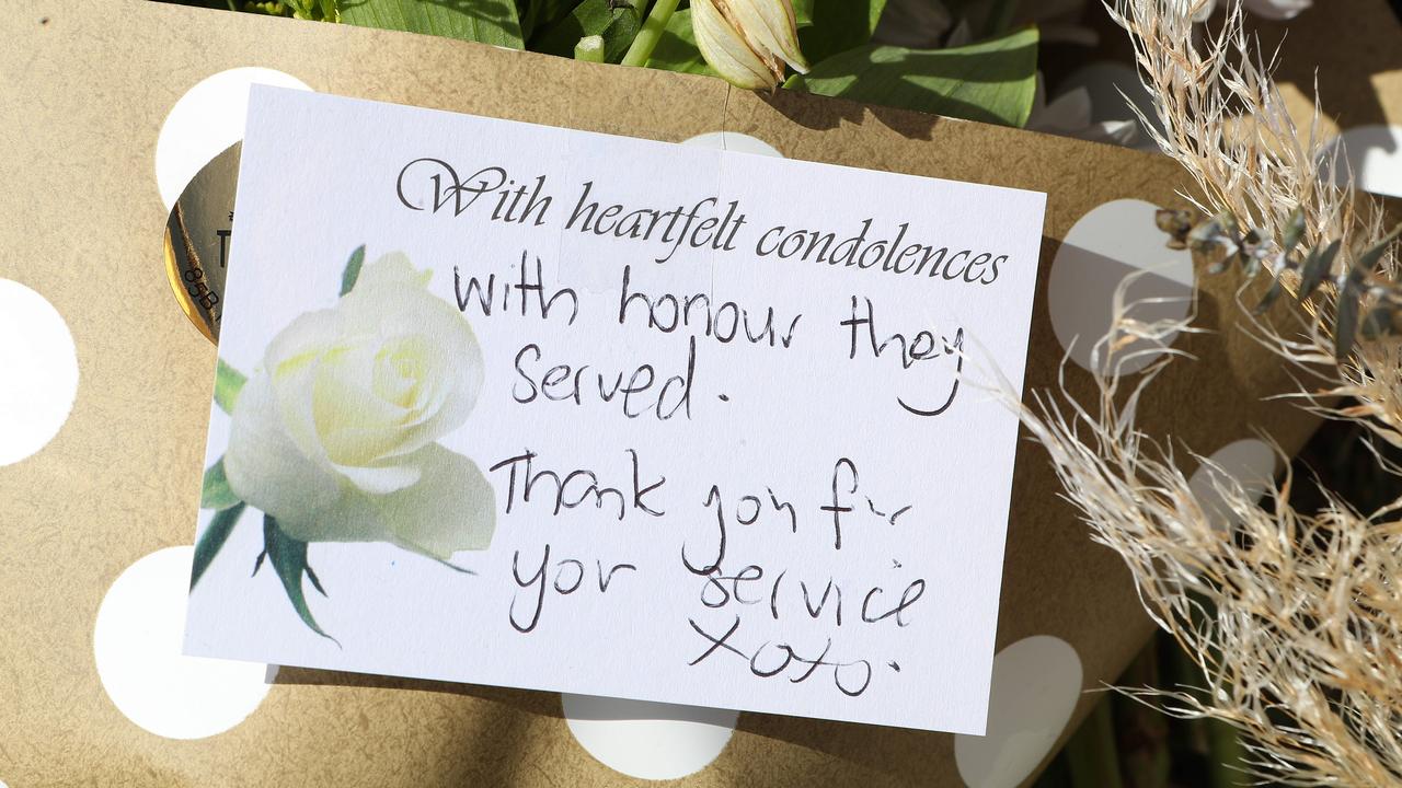 Tributes left outside the Chinchilla Police Station. Picture: Liam Kidston