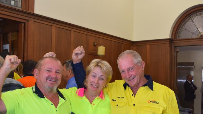 Peter Saal, Malcolm Biegel and Di Saal celebrate their win in April 2018 when councillors voted six-to-two to approve their development application.