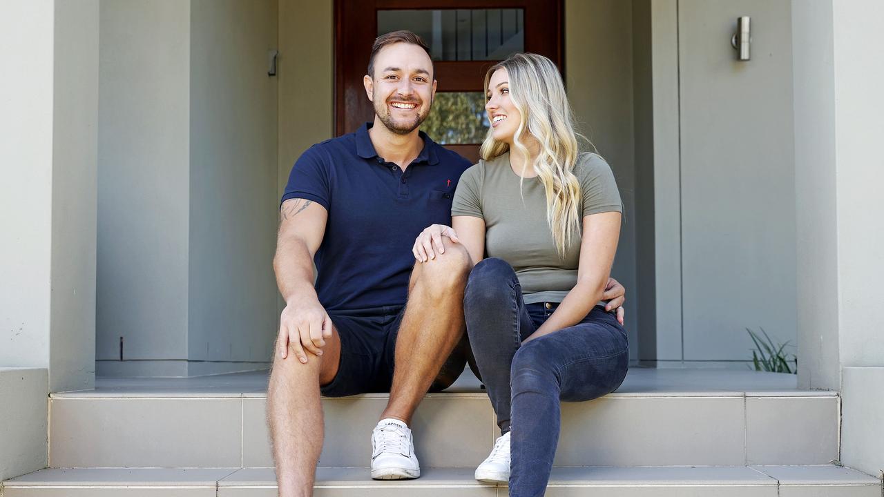 Daniel Walsh, with wife Sophie, bought 13 homes while he worked as a train driver. Picture: Tim Hunter